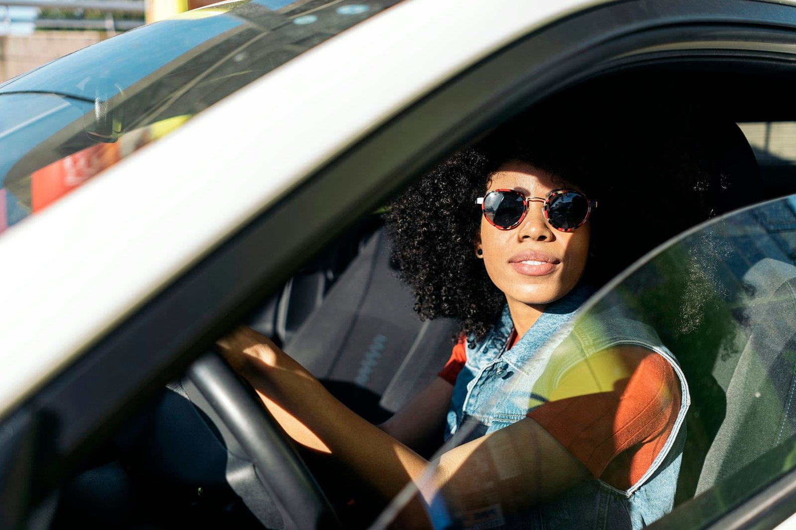 Afro Woman Driving her Car